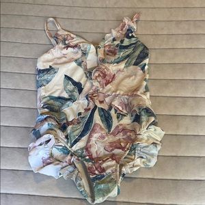 Girls swimsuit and flip flops